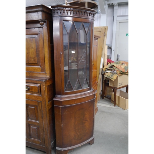 2506 - An astragal glazed mahogany corner cabinet