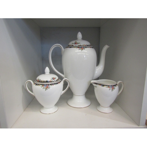 1496 - A Wedgwood three piece coffee set comprising of coffee pot, milk jug and sugar bowl