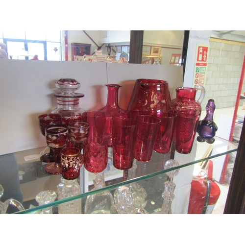 1541 - A selection of Victorian and later cranberry glass and similar, including a jug with hand-painted de... 