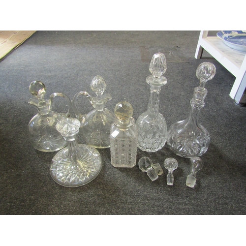 1542 - Four various cut glass decanters, a pair of claret jugs with associated stoppers and four various ot... 