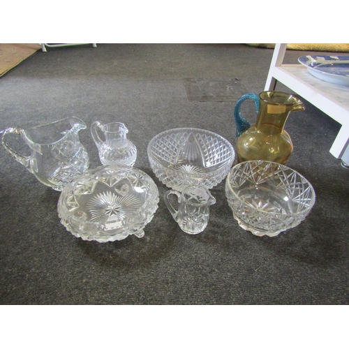 1544 - Three various cut glass fruit bowls. Two cut glass milk jugs and a table water jug. A dimpled amber ... 