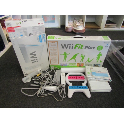 1553 - A Nintendo Wii games console with Wii Fit Plus, games, controllers, Wii Fit board and acessories etc... 