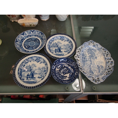 1573 - A pair of early 19th Century Davenport blue and white tea plates, printed with figures in a river la... 