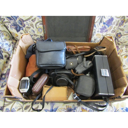 1591 - A mixed box of 35mm cameras and lenses including a Canon Canonet