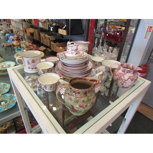 1613 - A collection of 19th Century pink lustre tea wares including jugs, a mug, cups and saucers and a pin... 