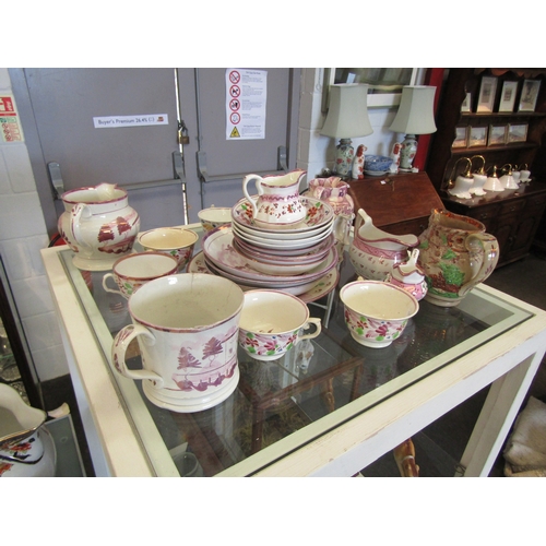 1613 - A collection of 19th Century pink lustre tea wares including jugs, a mug, cups and saucers and a pin... 