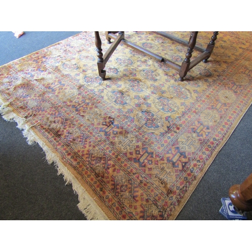 1619 - A mustard ground wool rug, geometric design, multiple borders, tasselled ends, 270cm x 180cm