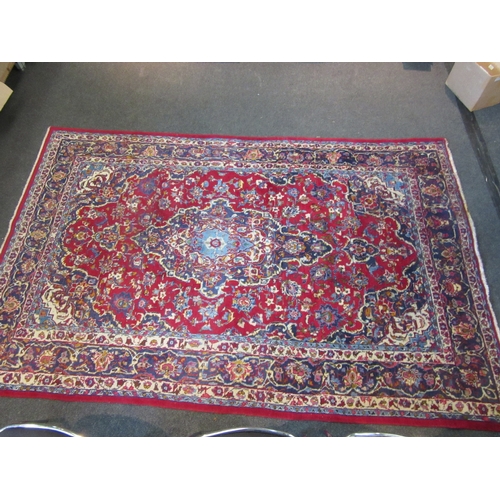 1198 - A Turkish wool red ground rug, multiple borders, 200cm x 310cm