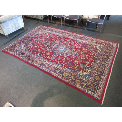 1198 - A Turkish wool red ground rug, multiple borders, 200cm x 310cm