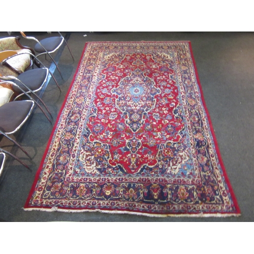 1198 - A Turkish wool red ground rug, multiple borders, 200cm x 310cm