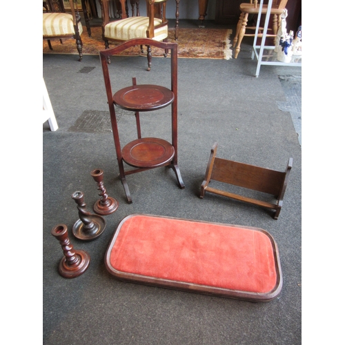 1259 - An Edwardian oak small book through and an oak two-tier folding cake stand. A pair of stained wood b... 