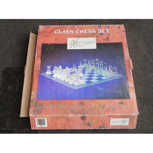 1293 - A Harrogate House glass chess set, with clear and frosted glass pieces, all pieces are present, in o... 