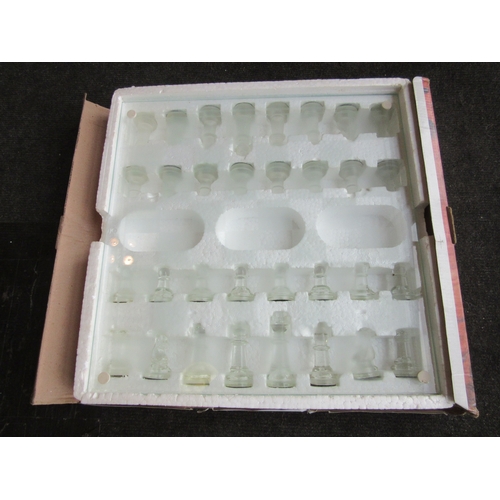 1293 - A Harrogate House glass chess set, with clear and frosted glass pieces, all pieces are present, in o... 