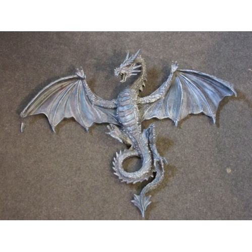 1296 - A large wall mounting resin painted dragon, wing and claw a/f, 58cm x 74cm