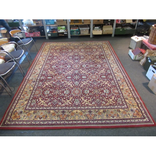 1622 - A modern red and gold ground carpet with floral decoration, multiple borders, 345cm x 250cm