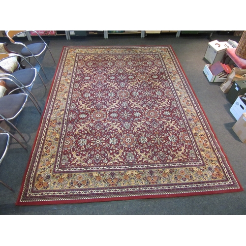 1622 - A modern red and gold ground carpet with floral decoration, multiple borders, 345cm x 250cm