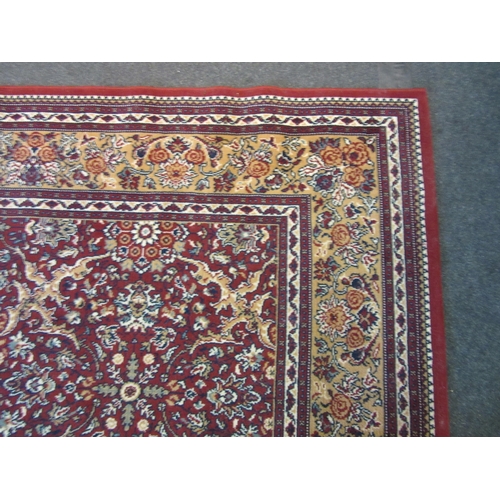 1622 - A modern red and gold ground carpet with floral decoration, multiple borders, 345cm x 250cm