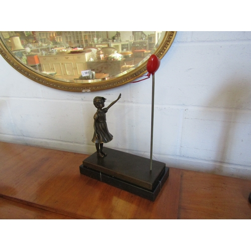 1011 - A bronze of girl with balloon after Banksy on marble base, 39cm tall