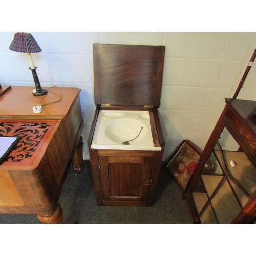 1021 - A late Victorian mahogany campaign wash cupboard with ceramic basin and brass waste