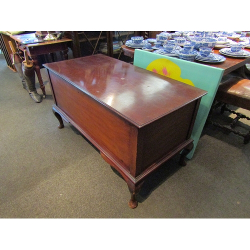 1104 - A large mahogany storage chest raised on cabriole legs to pad feet, 67cm tall x 122cm wide x 63cm de... 