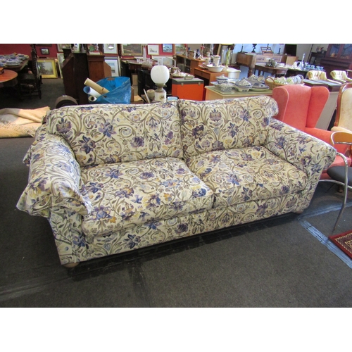 1196 - A Multiyork large two seater sofa with floral upholstery