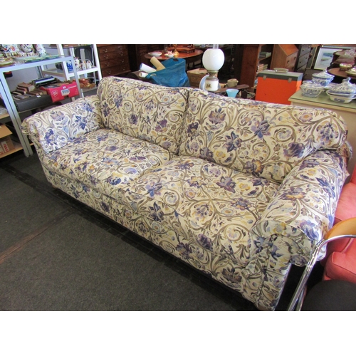 1196 - A Multiyork large two seater sofa with floral upholstery