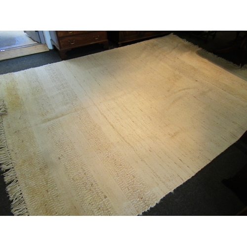 1621 - A large modern beige ground kilim rug with tasselled ends, some discolouration, 370cm x 270cm