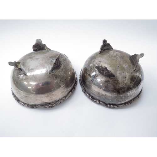 6444 - Two silver bowls raised on three feet with scroll decorated rim, both marked 800, 6cm tall, 11cm dia... 