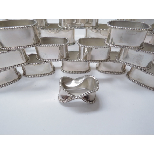 6448 - Twelve large Netherlands silver napkin rings assay mark for Schoonhoven 835 and twelve miniature rin... 