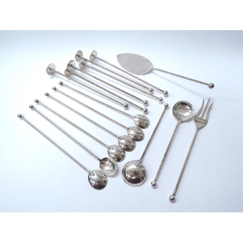 6447 - A quantity of Netherlands silver flatware with long spiral handles, two types of spoons, ice crusher... 