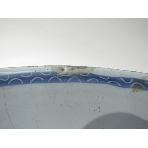 6265 - An 18th Century porcelain blue & white bowl, the exterior decorated with narrative figures, some dam... 