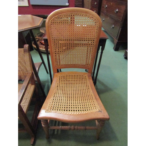 4103 - An early 20th Century light wood arch-back bedroom chair with caned seat and back