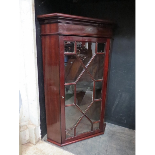 4148 - A Georgian mahogany astragal glazed single door corner cabinet of small proportions, with key, 76cm ... 