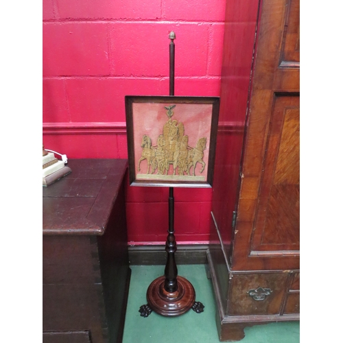 4151 - A Regency rosewood pole screen with brass fluted finial over a needlepoint and velvet depiction of 