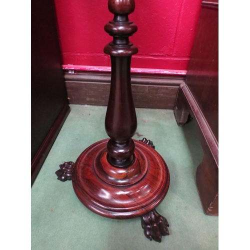 4151 - A Regency rosewood pole screen with brass fluted finial over a needlepoint and velvet depiction of 