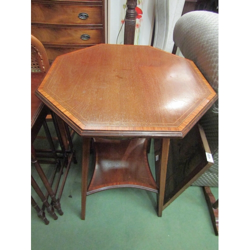 4234 - An Edwardian cross-banded mahogany occasional table with octagonal top and concave square under tier... 