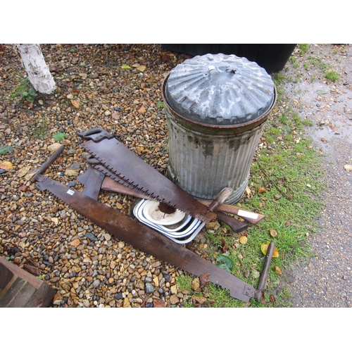 3384 - A galvanised bin, bygone saws, axes, etc