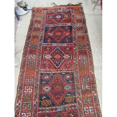 6452 - A mid 20th Century Caucasian Kazak runner rug, hand woven, 450cm x 111cm