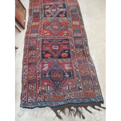 6452 - A mid 20th Century Caucasian Kazak runner rug, hand woven, 450cm x 111cm