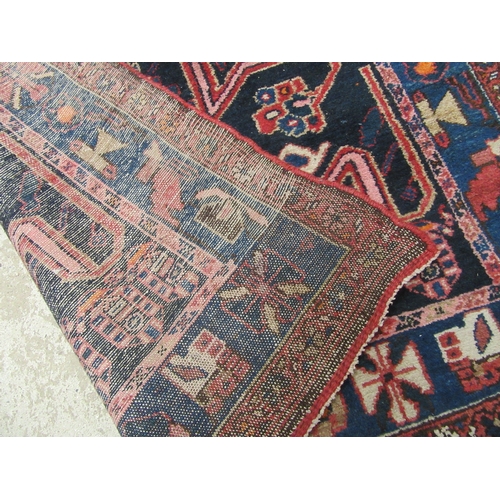 6457 - A mid 20th Century Persian Nahavand hand woven rug, deep blue colour with floral and animal motifs, ... 