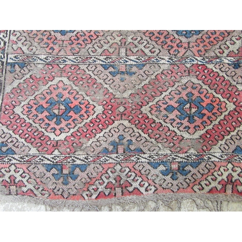 6461 - A Turkoman tribal handwoven rug with hook lozenge motif, red, blue, whites, 218cm x 107cm