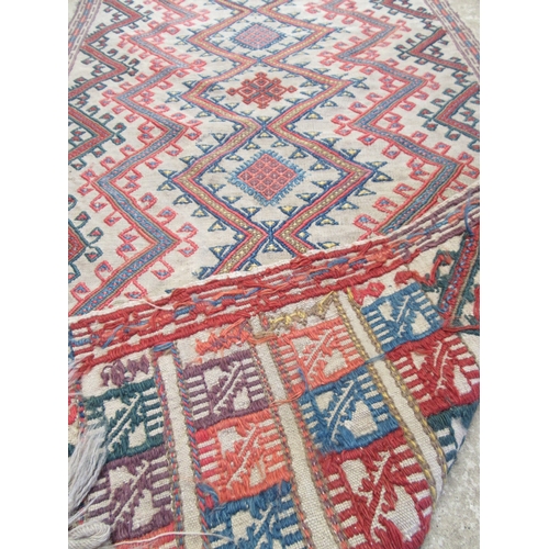 6464 - An early to mid 20th Century slim hand woven runner with lozenge and zig-zag pattern 378cm x 58cm