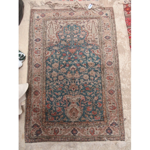 6468 - A Persian prayer rug the central field decorated with vase and sprawling flowers, 132cm x 88cm