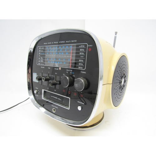 7433 - A 1970s Wynford Hall TCM-5500 8-Track stereo in space helmet form plastic casing with integrated spe... 