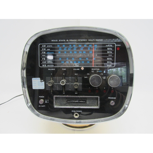 7433 - A 1970s Wynford Hall TCM-5500 8-Track stereo in space helmet form plastic casing with integrated spe... 