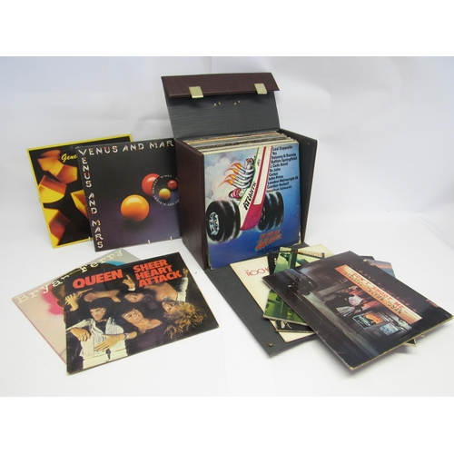 7114 - A record case containing a collection of forty assorted Rock and Pop LPs including Genesis, Elton Jo... 