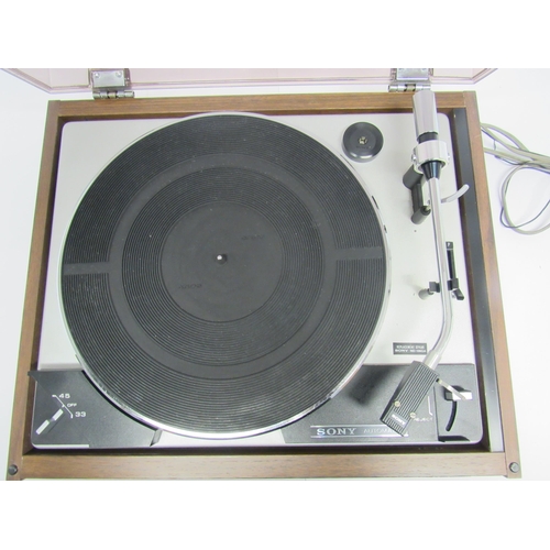 7464 - Hi-fi - A Sony PS 230 turntable, raised on teak effect base with smoked perspex lid