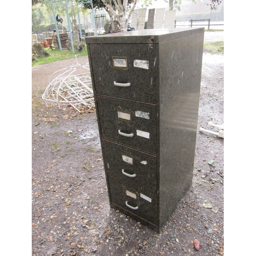 3519 - A four drawer metal filing cabinet