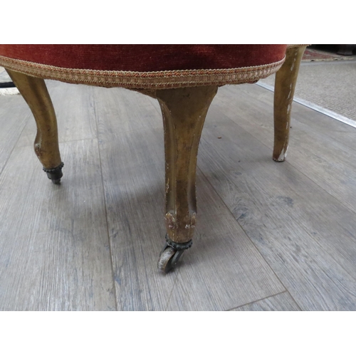 6004 - A Victorian spoon back upholstered bedroom chair on short gilded wood legs