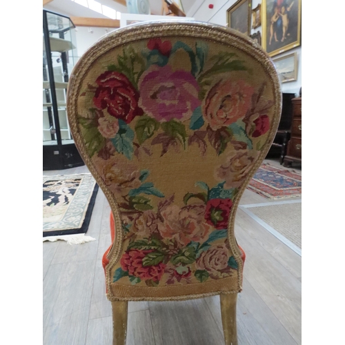 6004 - A Victorian spoon back upholstered bedroom chair on short gilded wood legs